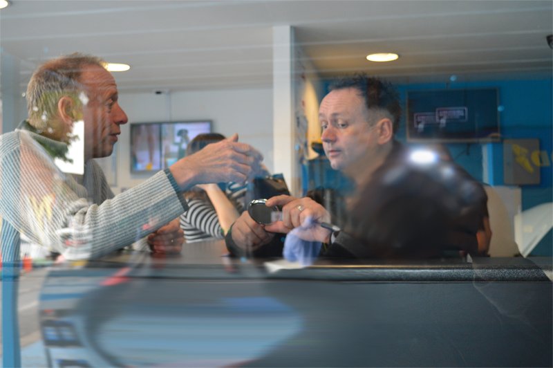 Our team mechanics helping customer on desk